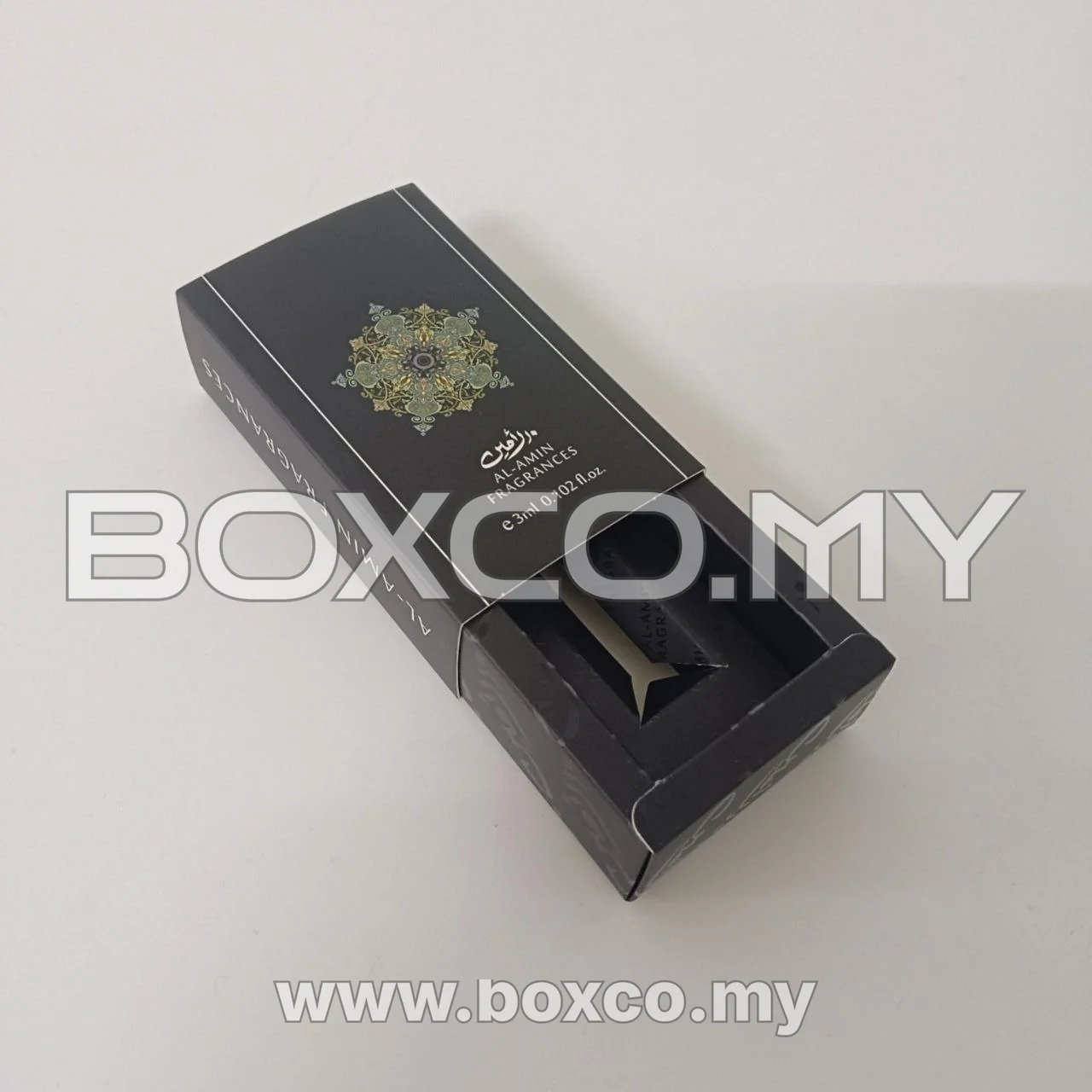 Black fragrance sample sleeve box with its inner drawer partly extended