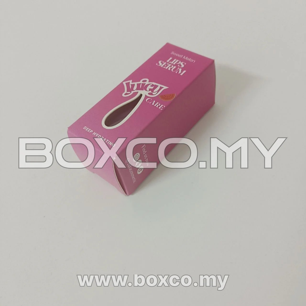 Angled rear-side view of a pink sweet melon lip serum folding carton